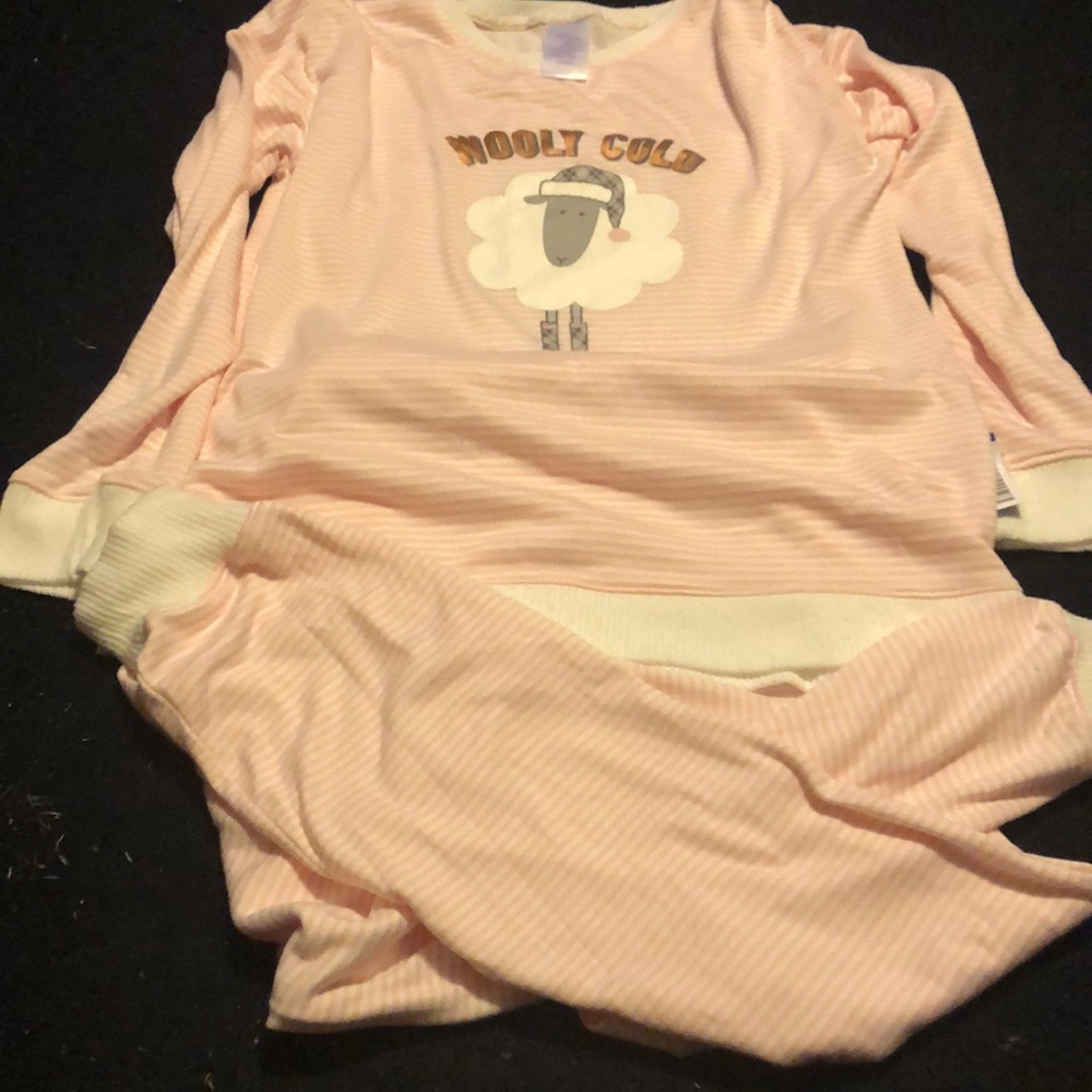 A pair of pink and white wooly cold pajamas.